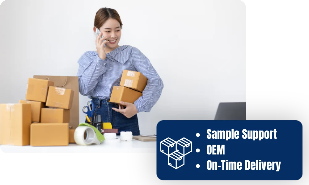 Office worker holding parcels beside shipping supplies